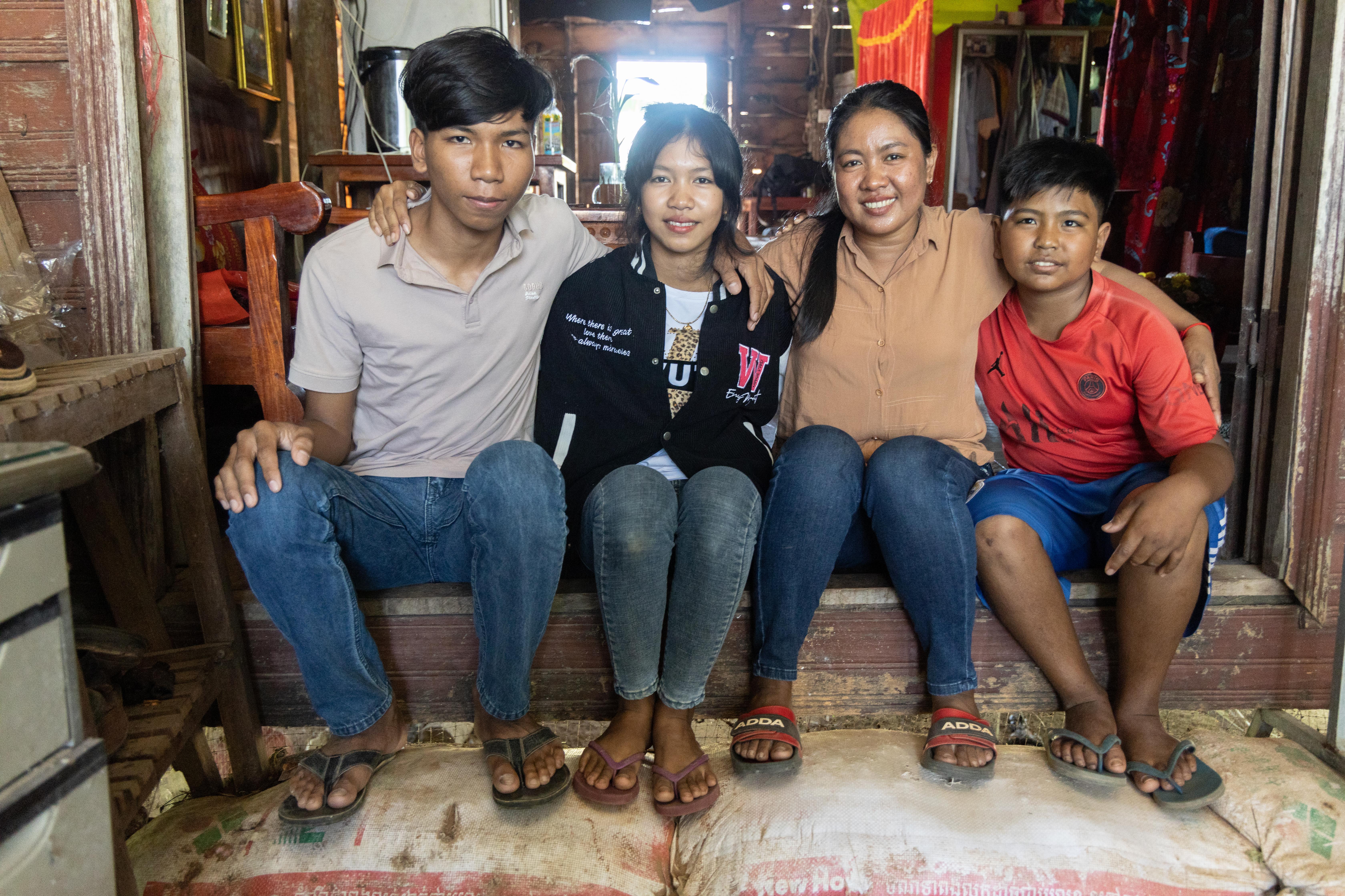 Set Hach poses proudly with her children. Left to right: Hoeum Bunhong (17), Hoeum Seyha (14), Set Hach (37) and Hoeum Lyhean (11).