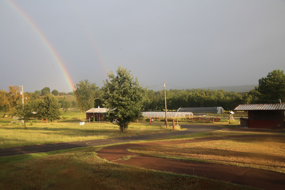 A rainbow shining over Heifer Ranch.