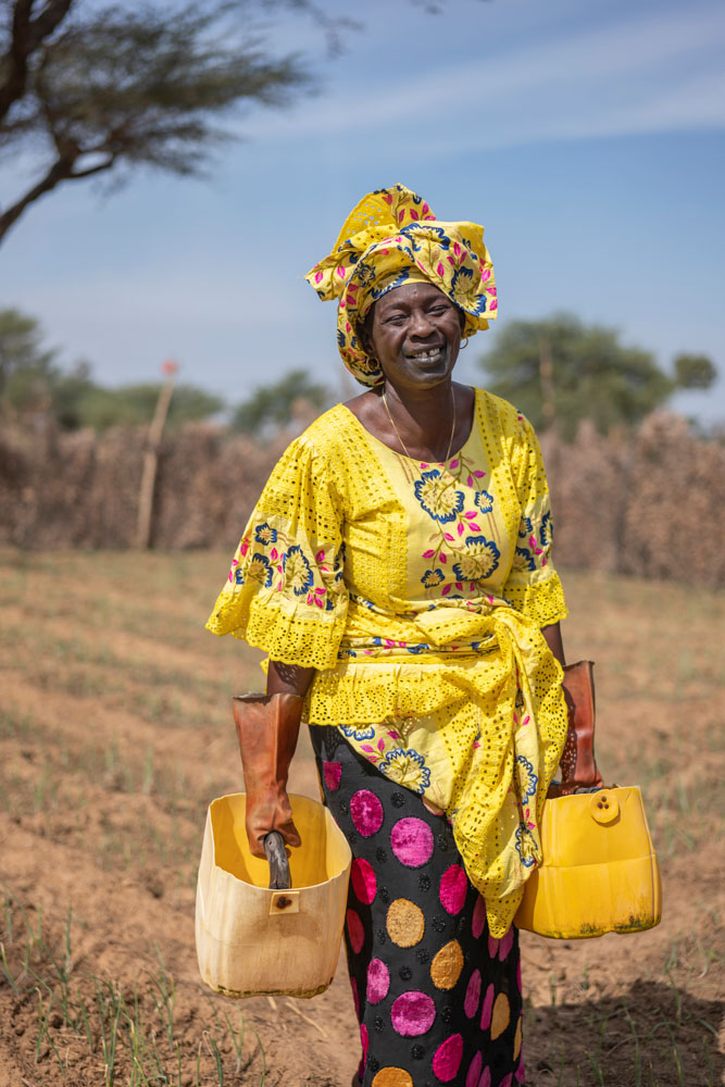 A woman works in her garden in Senegal.