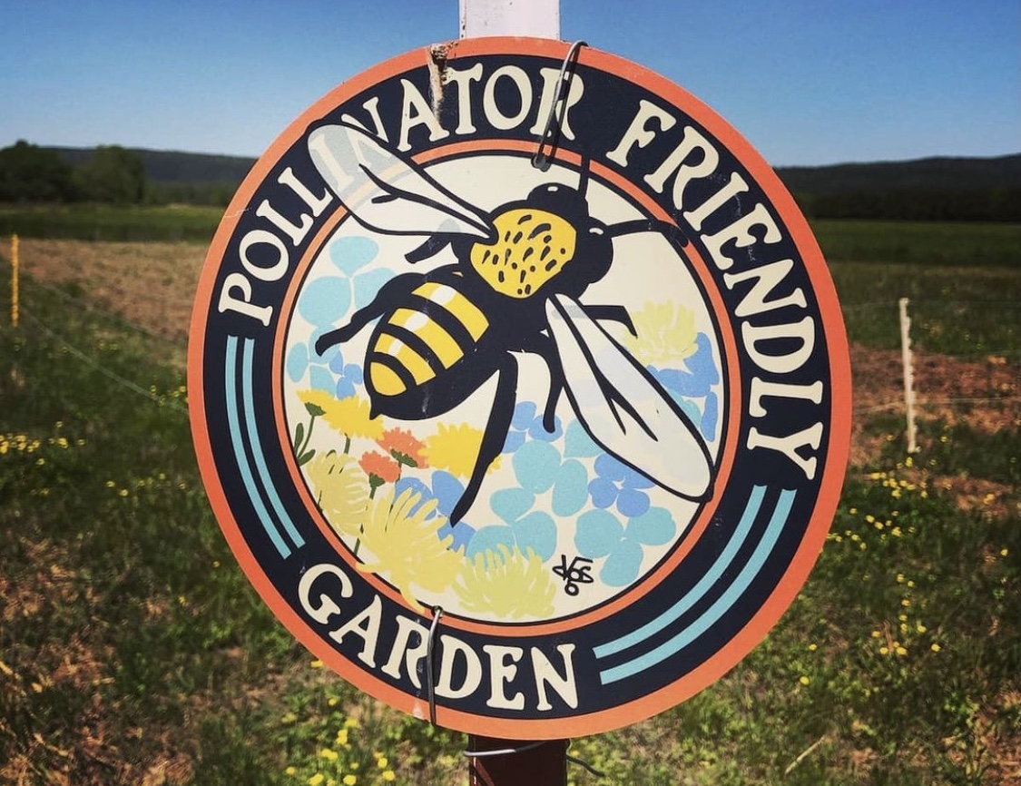 A pollinator-friendly garden sign