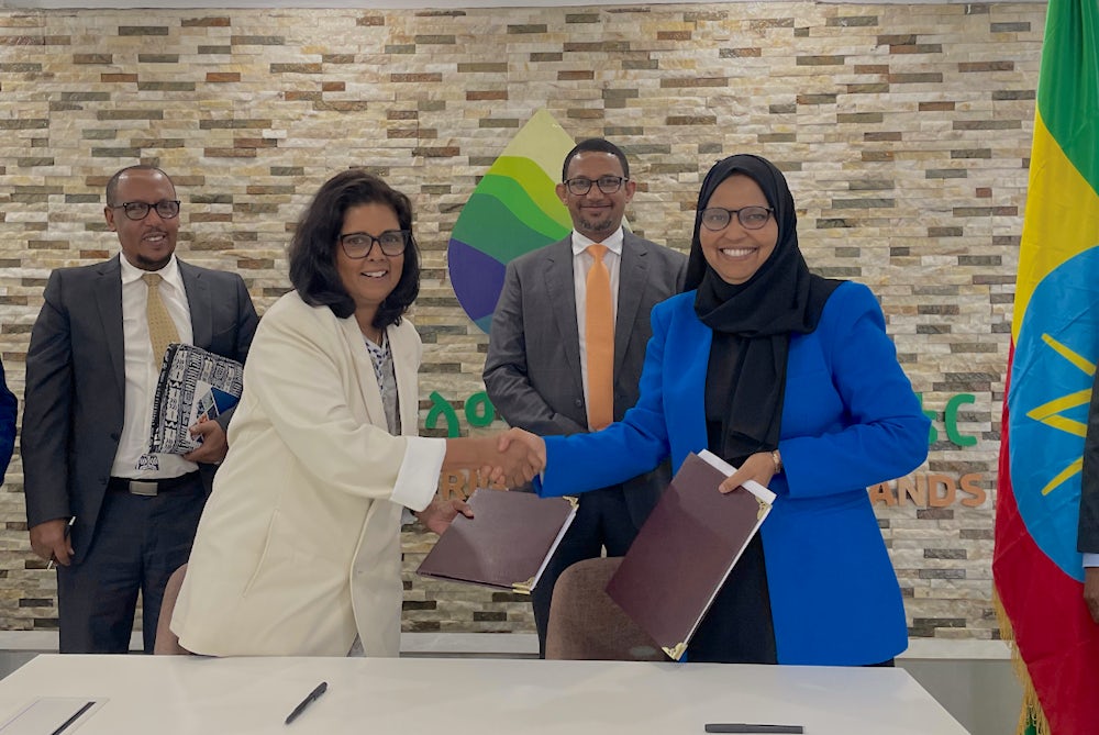 Surita Sandosham, president and CEO of Heifer International, shakes hands with H.E. Eng. Aisha M. Mussa, minister, Ministry of Irrigation and Lowlands, at a Memorandum of Understanding signing ceremony in Ethiopia.
