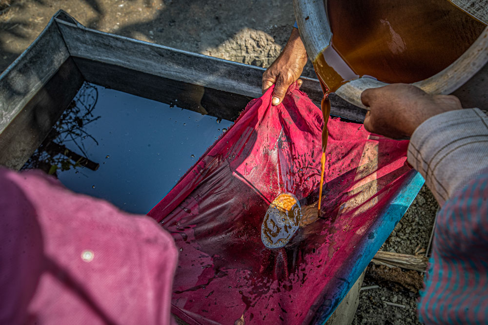 Mahfuza Aktar and her husband prepare date jaggery in Ramagari village, Bangladesh.