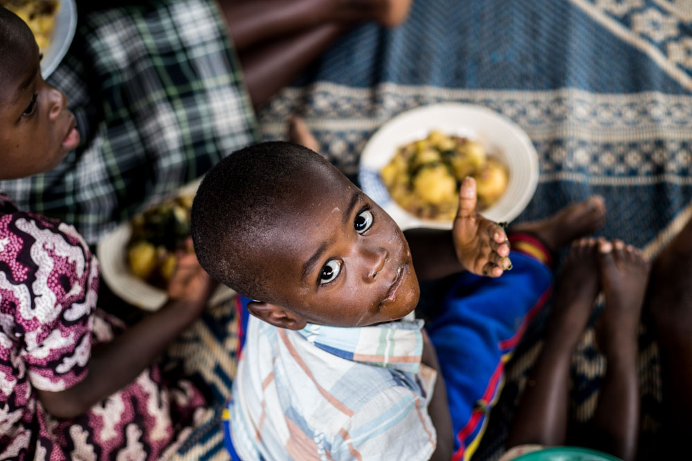 A boy enjoys a nutritious meal during a community kitchen program in Rugera sector, Nyabihu district, Northern province of Rwanda.