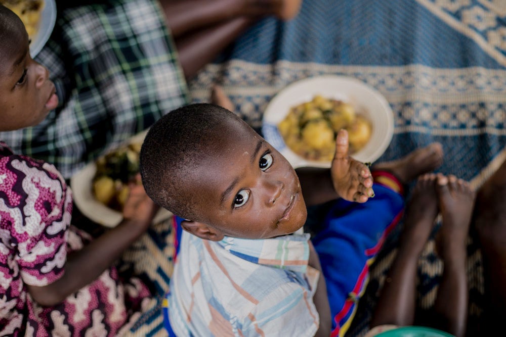 A boy enjoys a nutritious meal during a community kitchen program in Rugera sector, Nyabihu district, Northern province of Rwanda.