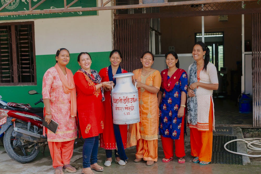 Members of the Bihani Social Entrepreneur Women's Cooperative stand together in Kopawa, Nepal.