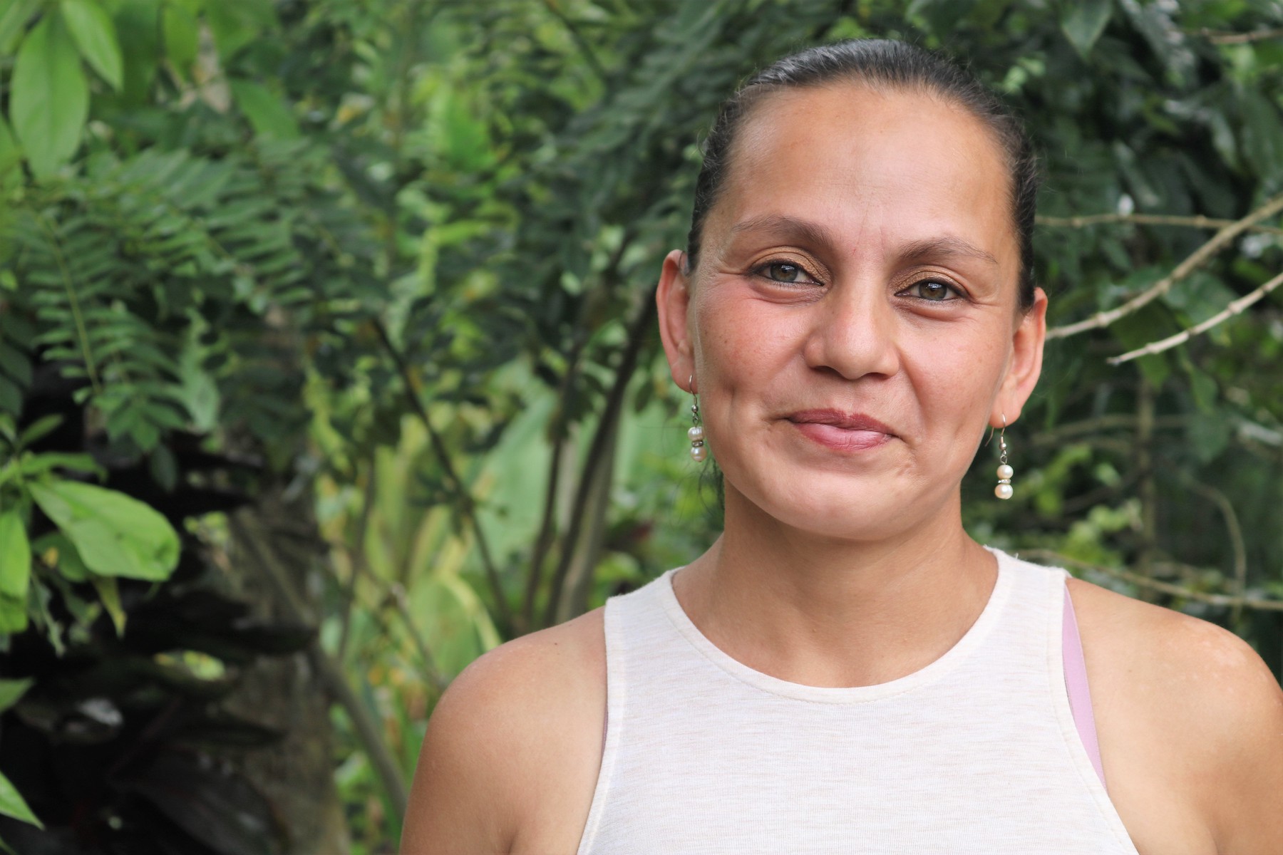 Close up portrait of a Honduran woman who keeps bees.
