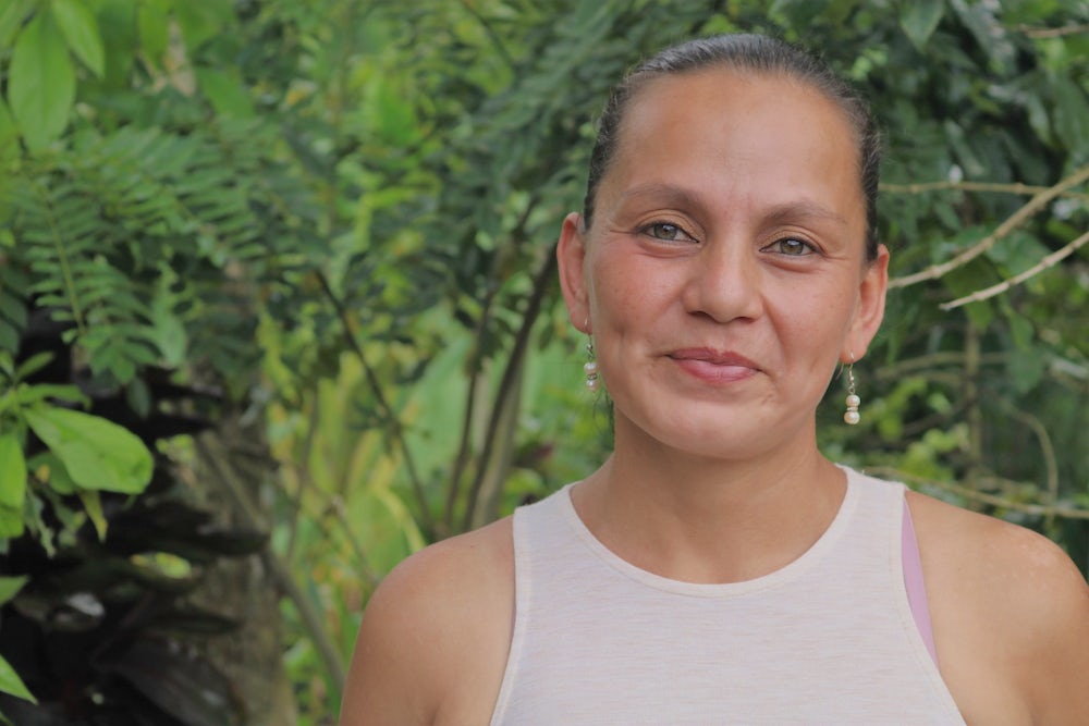 Close up portrait of a Honduran woman who keeps bees.