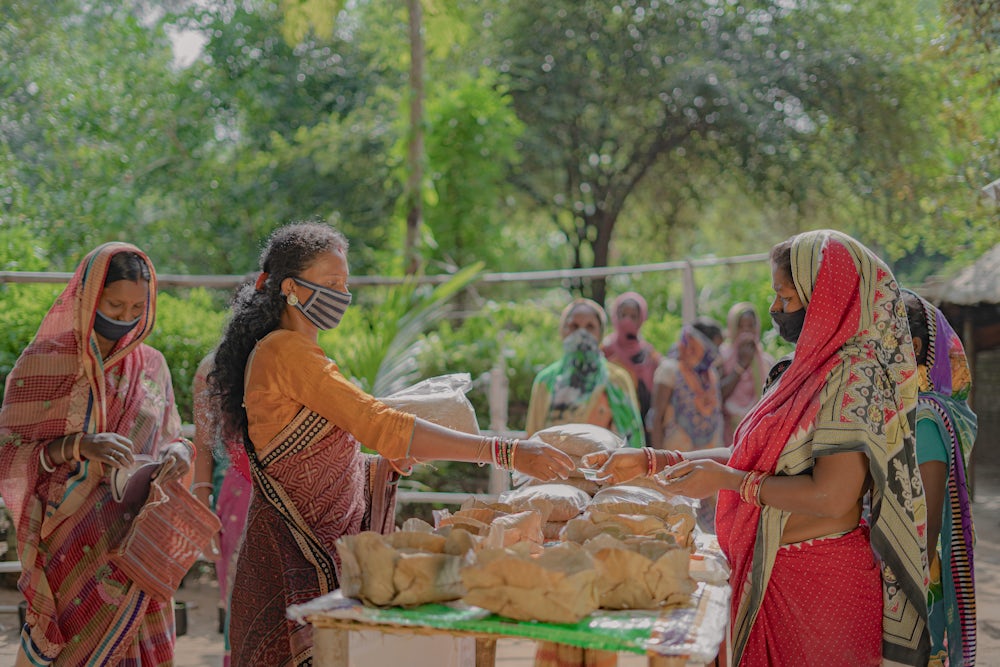 The sale of high quality chicken feed is an additional income that supports entrepreneurs like Lata Marndi. The profits from her feed mill are already paying off.Image by Heifer International/Pranab K. Aich
