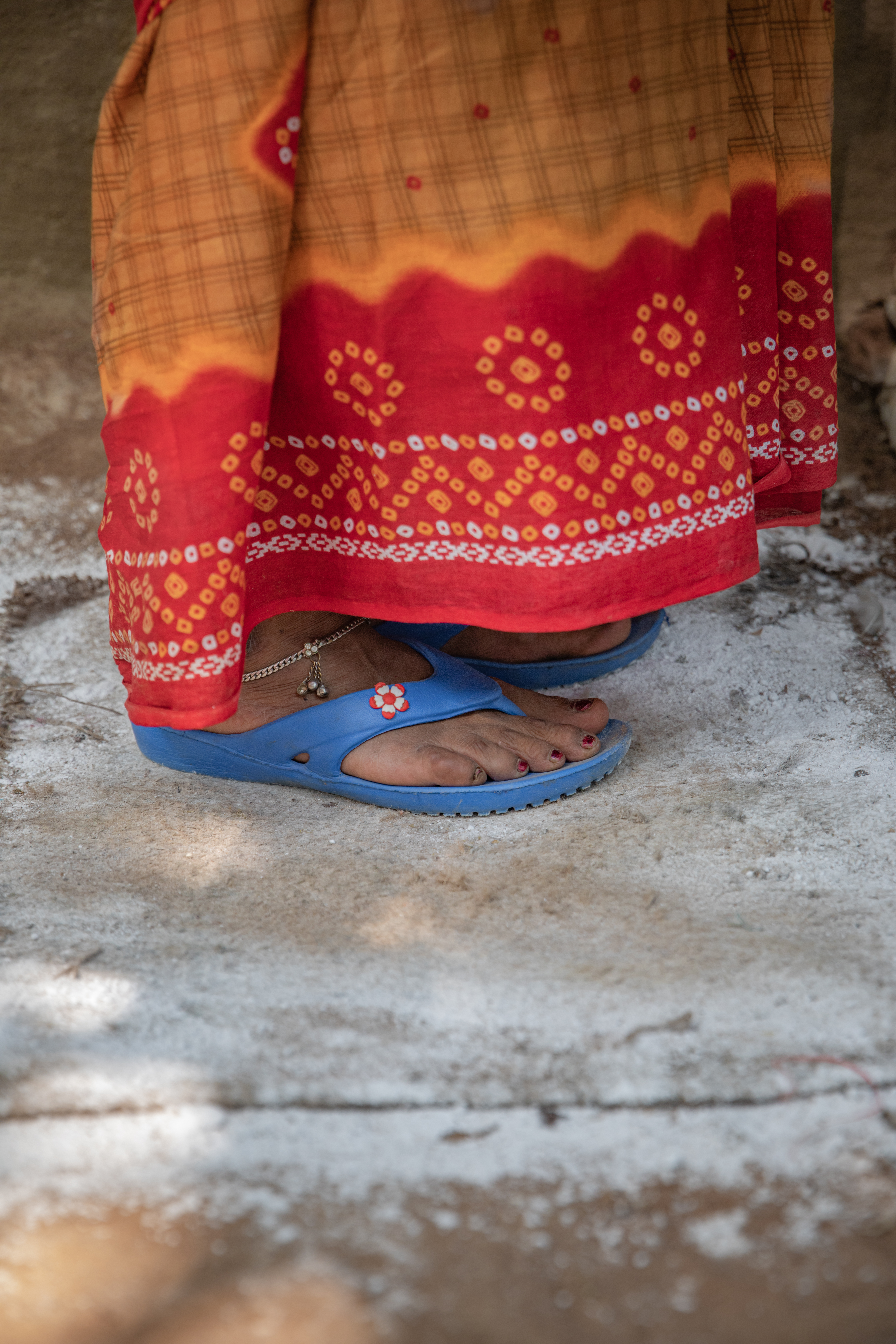The Hatching Hope Project trains smallholders to in low cost, effective methods to keep their chickens healthy. A quicklime footpath is cheap and kills pathogens. Image by Heifer International/Pranab K. Aich